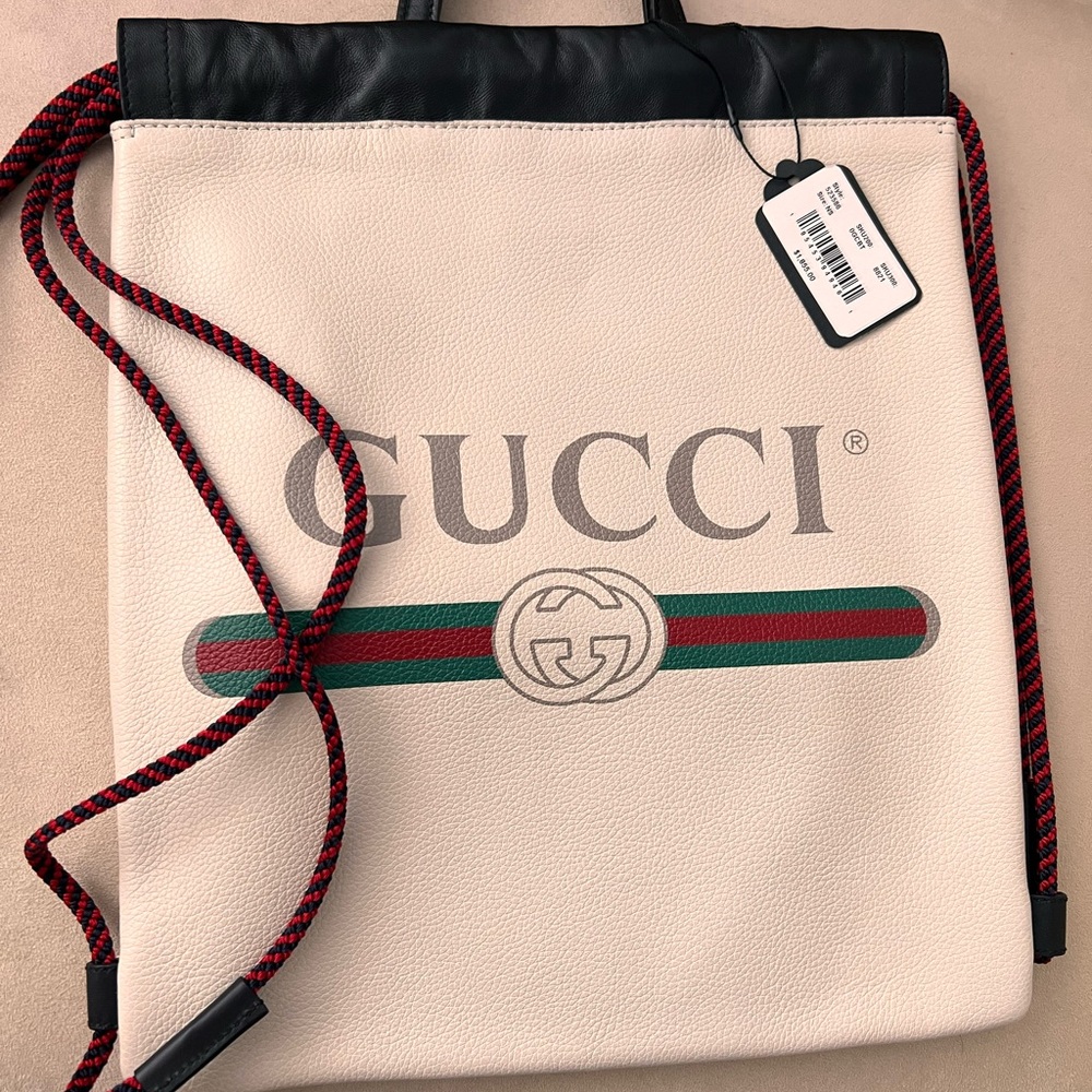 With dust bag and tag